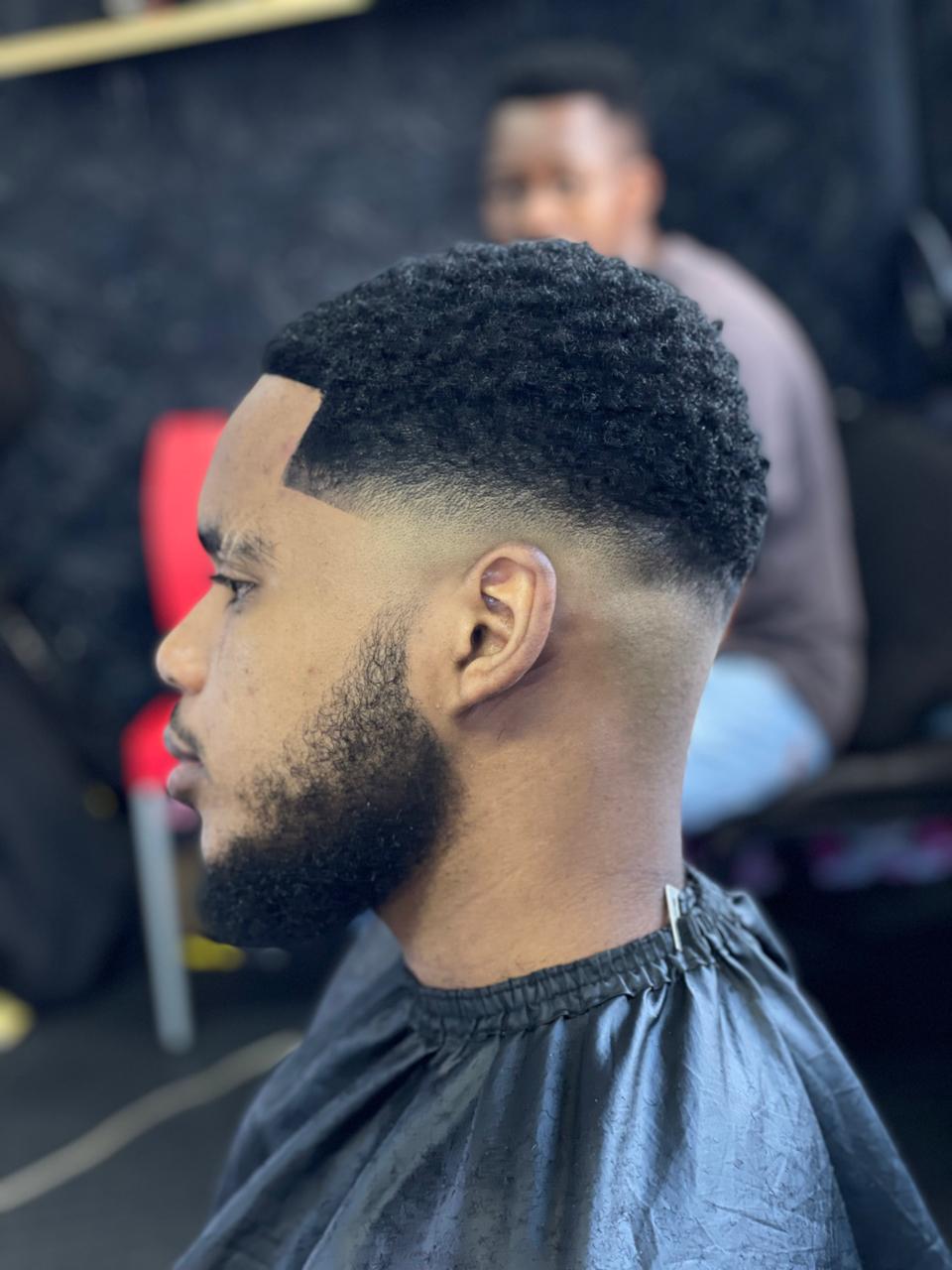 Precision skin fade with textured curls