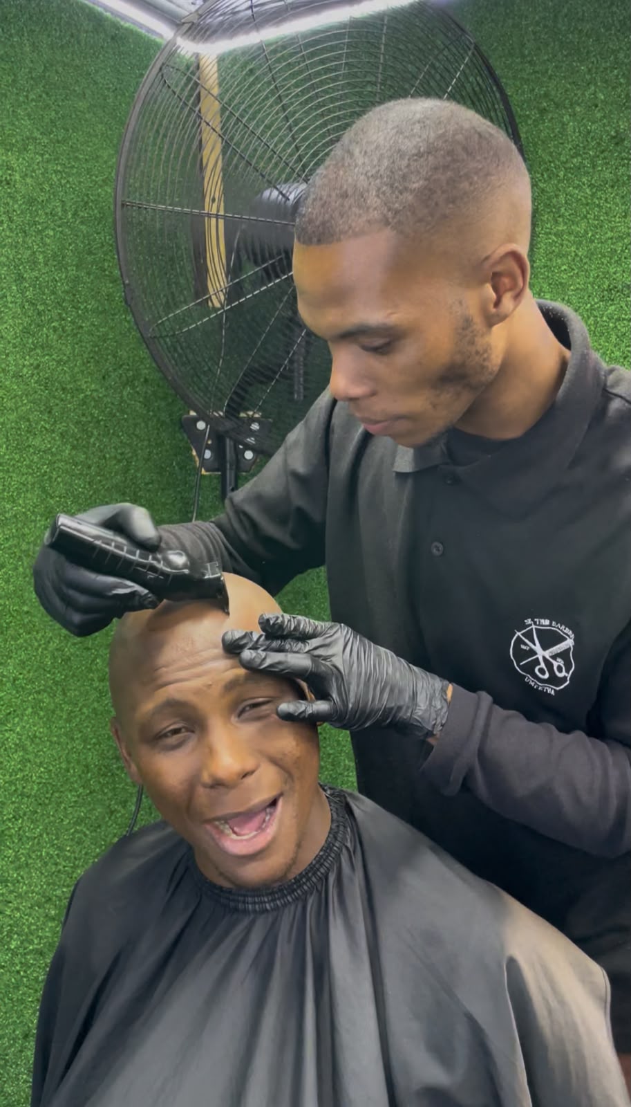 Client enjoying a fresh cut at S.K Alpha